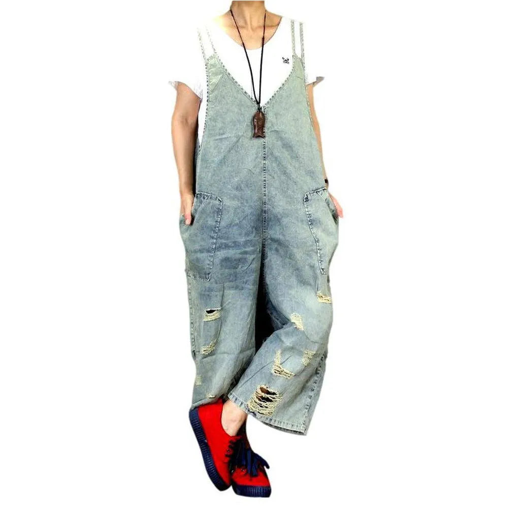 Distressed women's jean dungaree